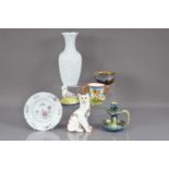 A Wemyss style pottery cat with glass eyes,