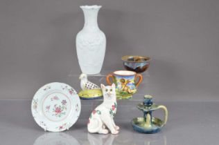 A Wemyss style pottery cat with glass eyes,
