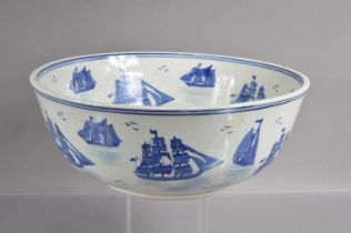 A large blue and white crackle glazed punch or fruit bowl decorated with sailing ships,