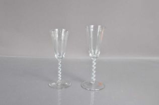 Two late Georgian glass ale drinking glasses,