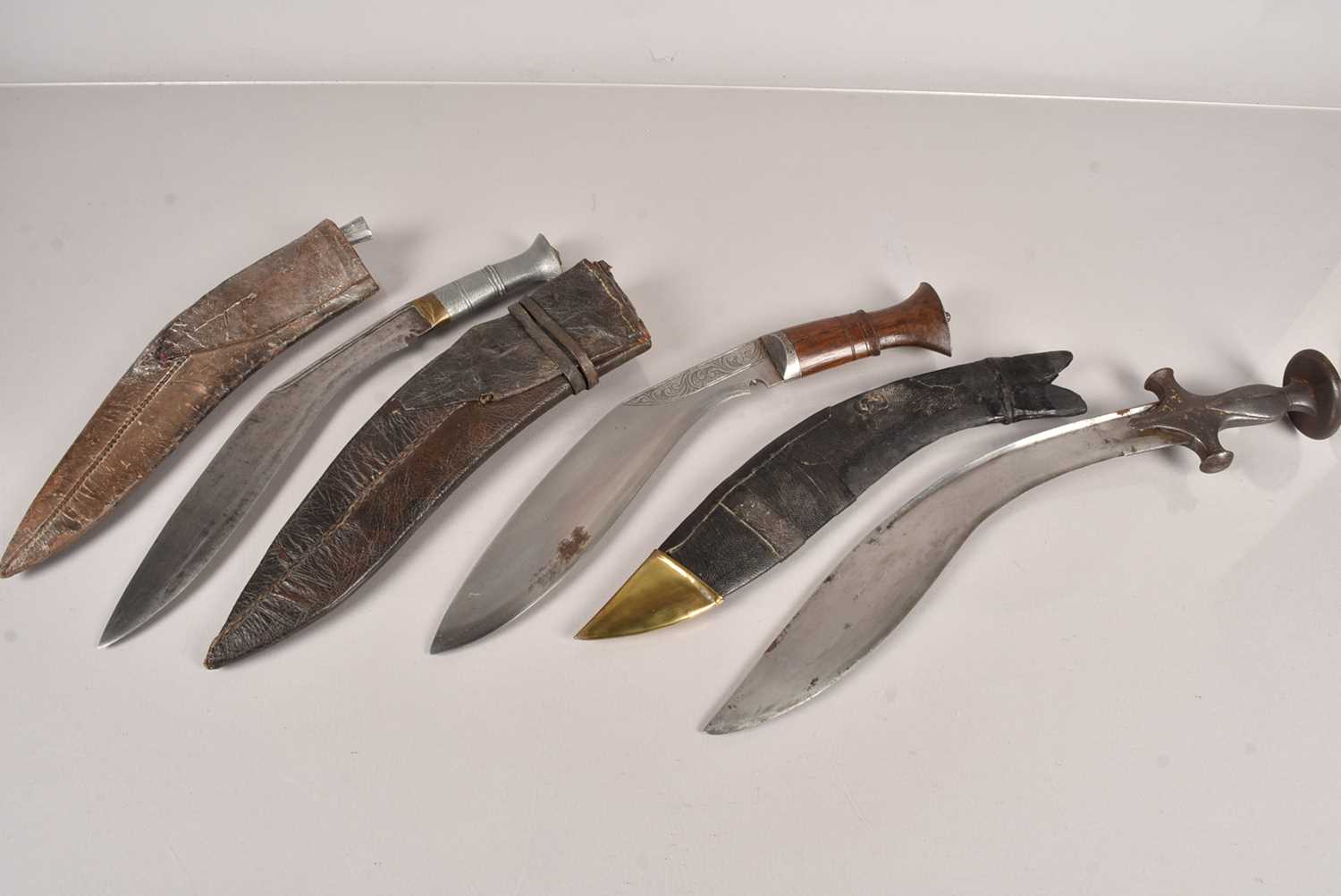 Three Middle Eastern Kukri knives,