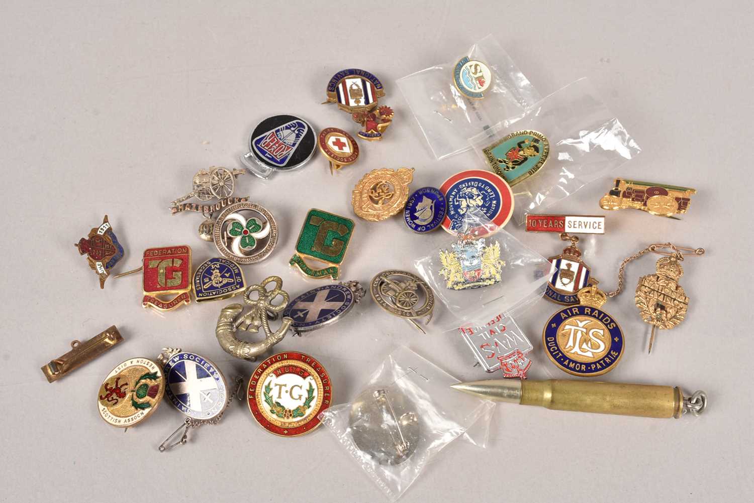 A collection of pin badges,