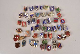 An assortment of US Army Unit Insignia badges,