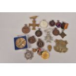 A collection of cycling and other medallions,