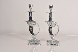 A pair of novelty German Sword hilt candlesticks,