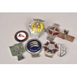 An assortment of Car Bumper Badges,