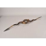 A horn and spear head wall ornament,