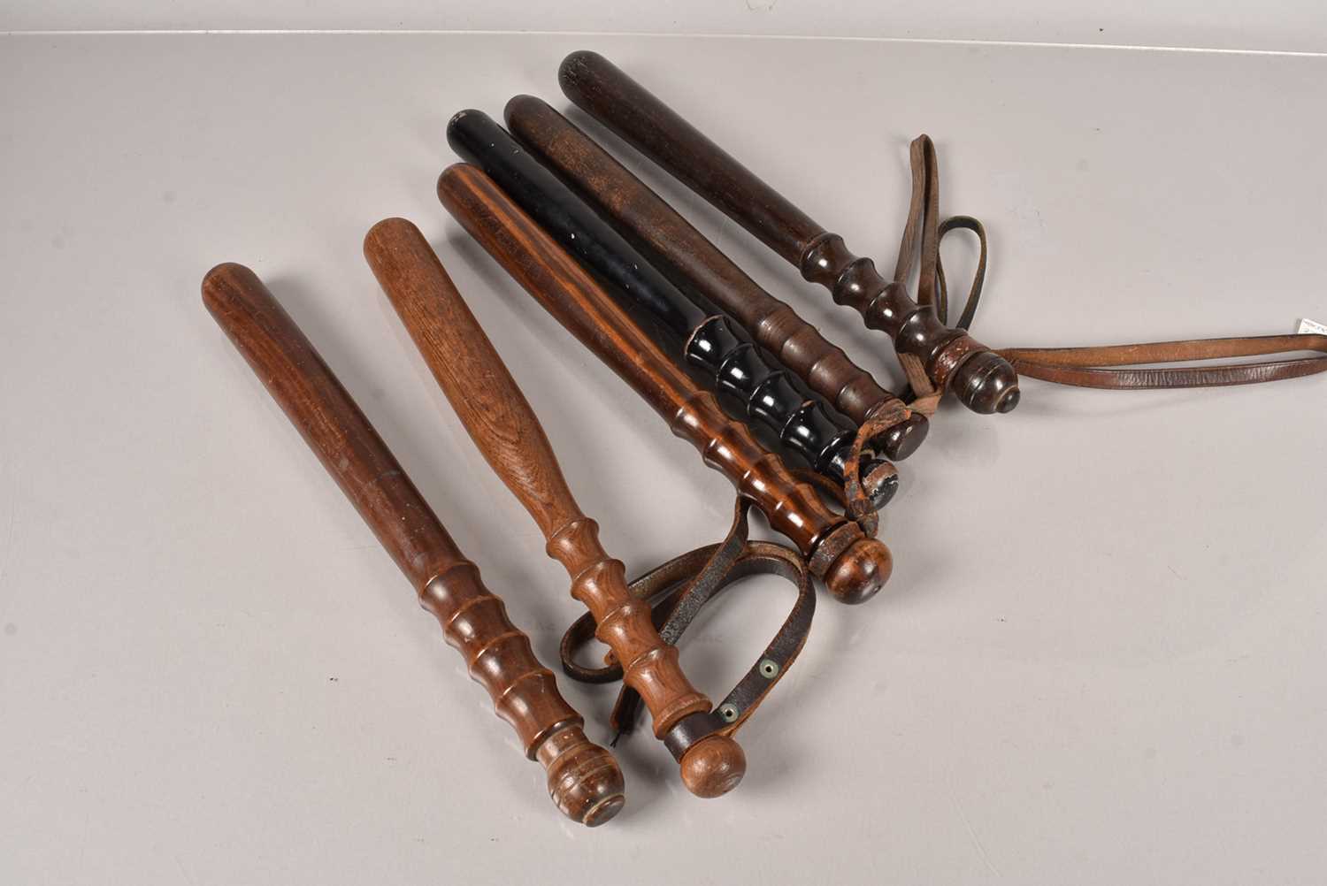 Six wooden Police Truncheons,