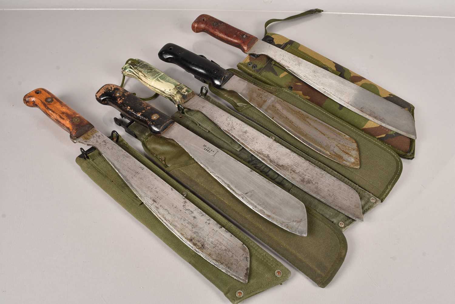 A group of five machetes,