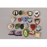 An assortment of Women's Institute enamel pin badges,