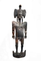 A large carved wooden African Male Figure,