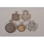 A collection of silver military medallions,