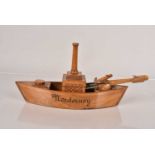 A vintage inkwell in the form of a German Ship,