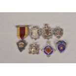 A collection of silver hallmarked cycling medals,