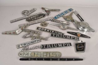 An assortment of British Car badges,