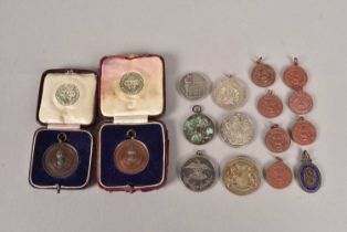 An assortment of military related medallions,