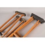 Two pairs of Vintage wooden medical crutches,