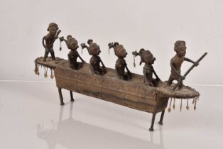 A Benin cast metal boat/canoe,