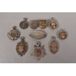 An assortment of silver hallmarked sporting medals,