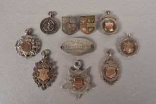 An assortment of silver hallmarked sporting medals,