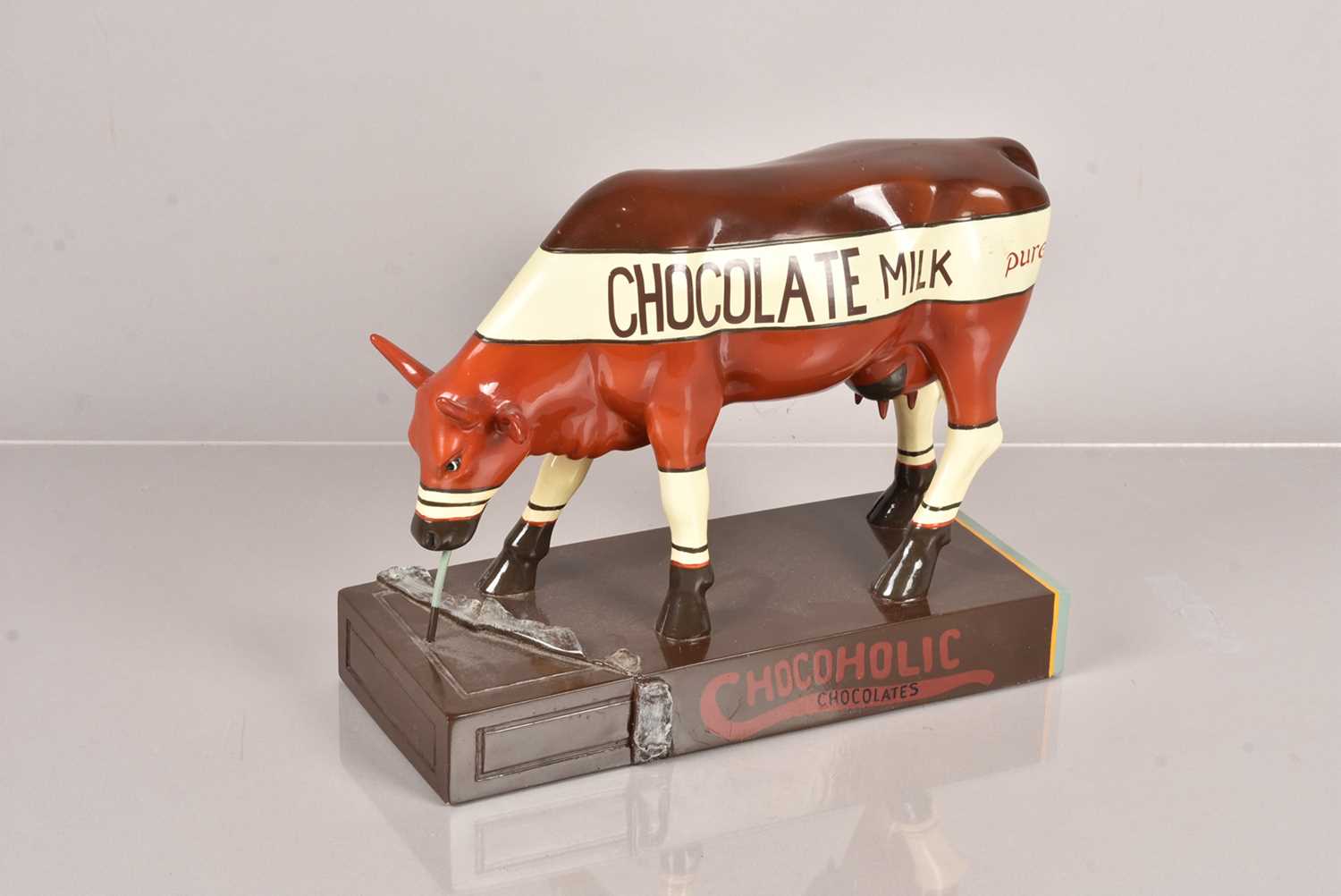 A vintage Chocoholic Chocolates Advertising Cow,