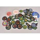 An assortment of Rifle Association related cloth and bullion badges,