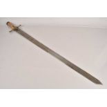 A large wooden handled broad sword,