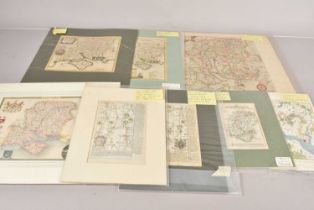 An assortment of various etched maps,
