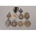 A collection of silver hallmarked cycling medals,