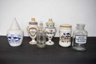 A group of four stoneware Pharmacist's containers,
