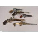 A group of five decorative wall mount pistols,