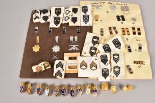 A collection of US Army Officer's and Aide de Camp badges,