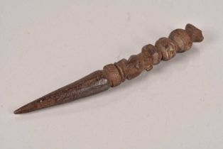 A carved wooden Ritual dagger,
