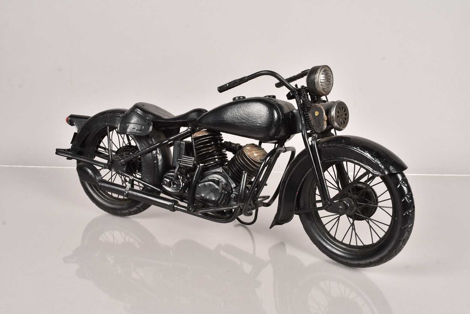 A black painted model of a Harley Davidson,