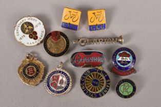 A small selection of cyclist badges,