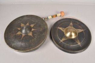 Two circular gongs,