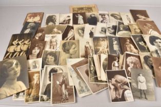 A collection of signed postcards and photographs,