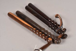 A group of four Metropolitan Police wooden truncheons,