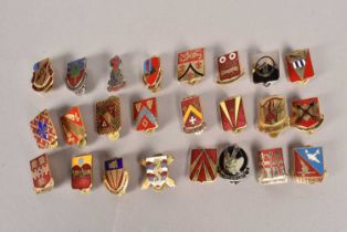 A collection of US Army DI Insignia badges,