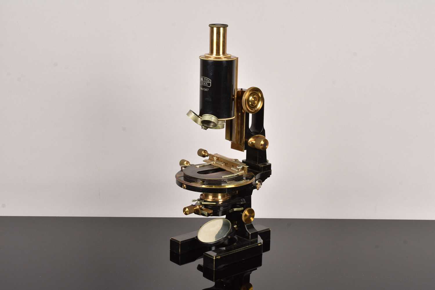 A Mid 20th Century black lacquered and brass Carl Zeiss 'Jug-Handle' Monocular Microscope,