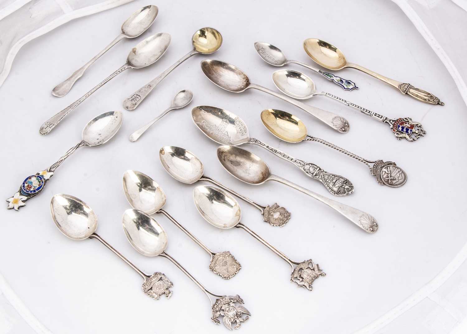 A collection of silver souvenir and other teaspoons,
