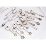 A collection of silver souvenir and other teaspoons,