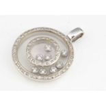 A continental white gold 750 double diamond set bezel circular pendant,