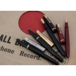 Four Parker fountain pens,