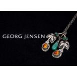 An early 20th century silver Georg Jensen chrysoprase and amber pendant no. 28,