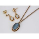 An opal doublet pendant on a 9ct gold chain,