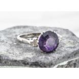 A platinum and 18ct gold amethyst and diamond dress ring,