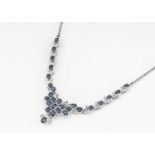 An Indian white 18k marked sapphire and diamond necklace,