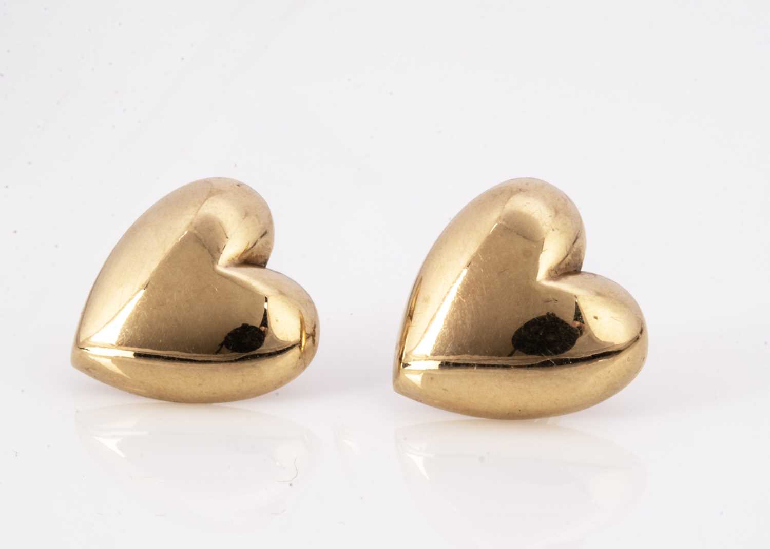 A pair of 9ct gold heart shaped stud earrings,
