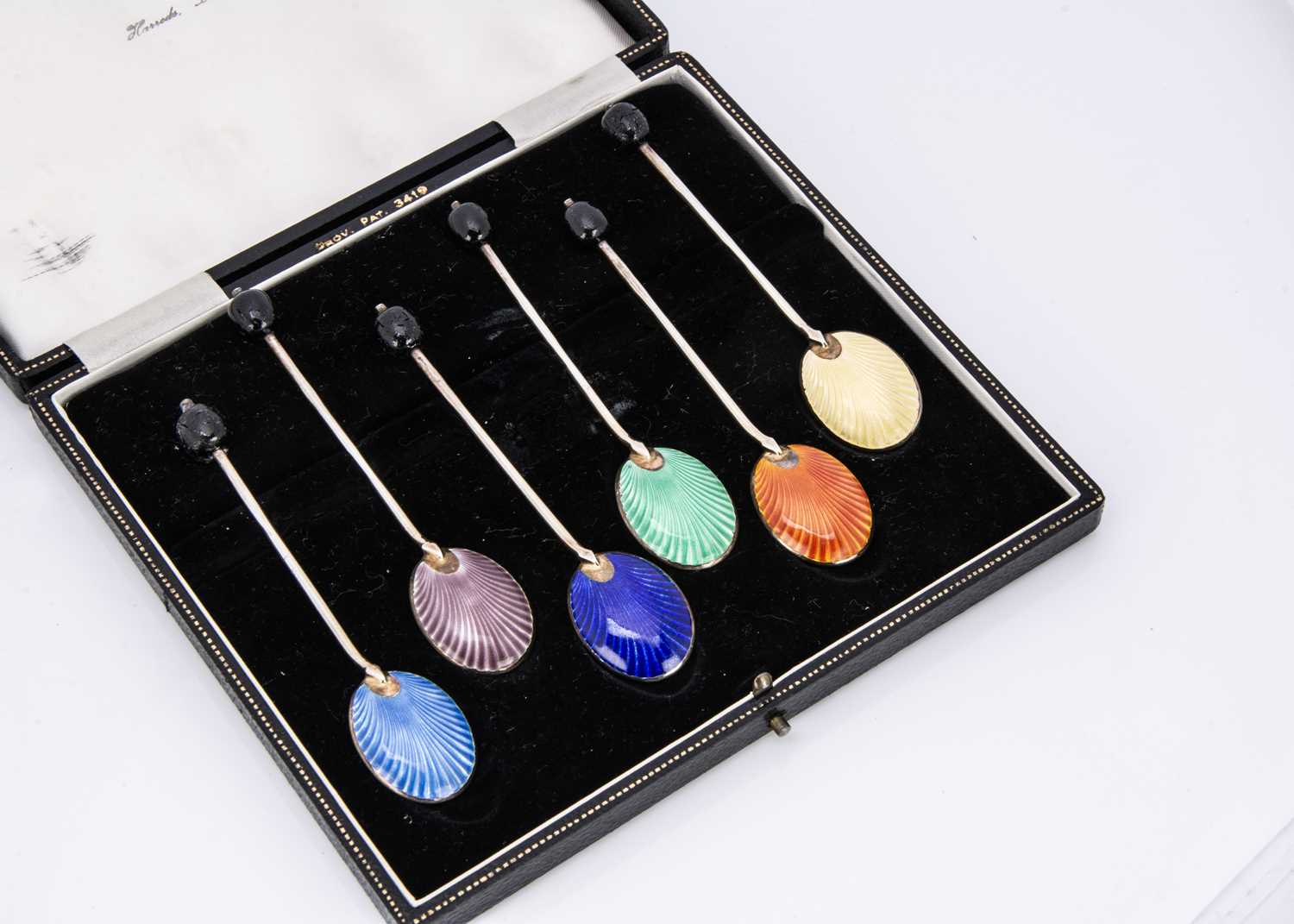 A c1960s set of six silver gilt and enamelled coffee bean spoons in a Harrods case,